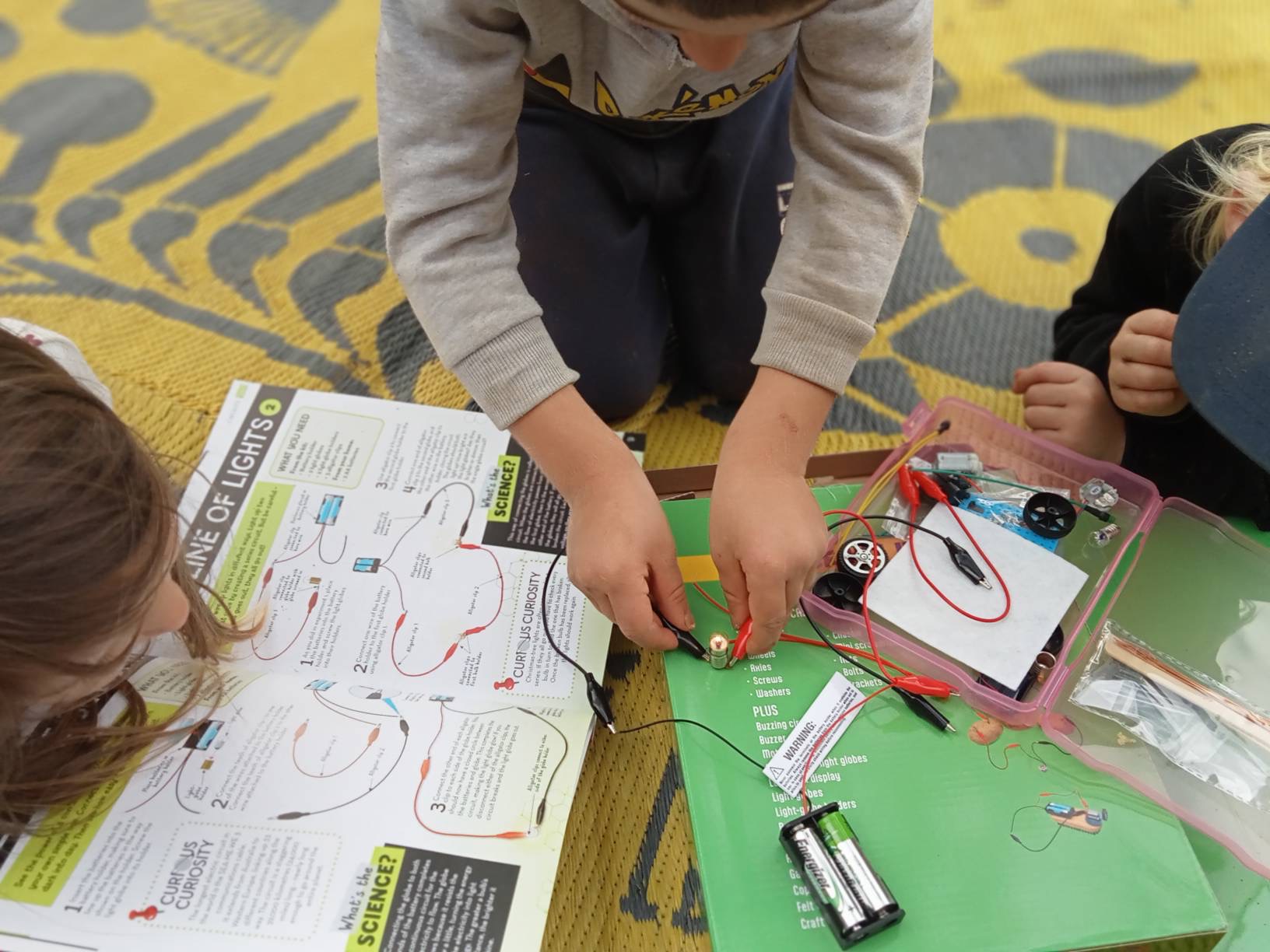 Children working on technologies and making on the property